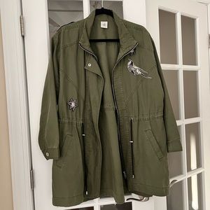 CAbi army green jacket. Charming stitched decorative patches, no rips nor tears.